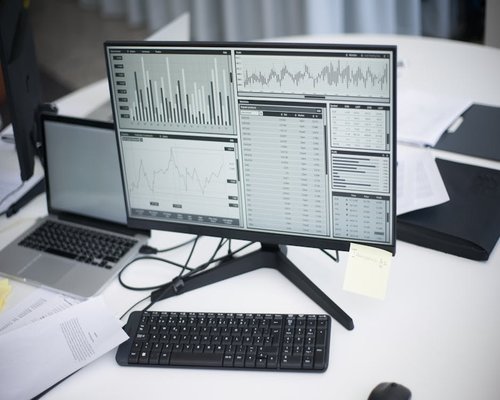 business intelligence dashboard displaying graphs and charts on screen